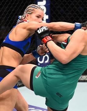 HOUSTON, TX - FEBRUARY 04:  (L-R) Felice Herrig punches Alexa Grasso of Mexico in their women's strawweight bout during the UFC Fight Night event at the Toyota Center on February 4, 2017 in Houston, Texas. (Photo by Jeff Bottari/Zuffa LLC/Zuffa LLC via Ge