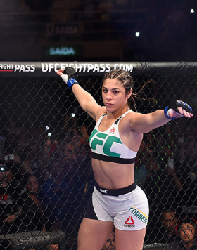 RIO DE JANEIRO, BRAZIL - AUGUST 01:  Bethe Correia of Brazil enters the Octagon before facing Ronda Rousey of the United States in their UFC women's bantamweight championship bout during the UFC 190 event inside HSBC Arena on August 1, 2015 in Rio de Jane