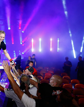 SAN DIEGO, CA - AUGUST 18:  Ronda Rousey reacts after defeating Sarah Kaufman by submission during the Strikeforce event at Valley View Casino Center on August 18, 2012 in San Diego, California. (Photo by Esther Lin/Forza LLC/Forza LLC via Getty Images)