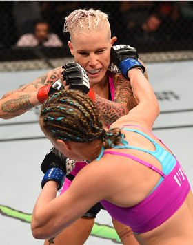 ADELAIDE, AUSTRALIA - MAY 10:   (R-L) Lisa Ellis punches Bec Rawlings in their women's strawweight bout during the UFC Fight Night event at the Adelaide Entertainment Centre on May 10, 2015 in Adelaide, Australia. (Photo by Josh Hedges/Zuffa LLC/Zuffa LLC