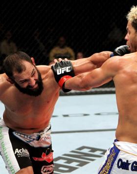 EAST RUTHERFORD, NJ - MAY 05:  Johny Hendricks (L) punches Josh Koscheck (R) during thier Welterweight bout at Izod Center on May 5, 2012 in East Rutherford, New Jersey.  (Photo by Josh Hedges/Zuffa LLC/Zuffa LLC via Getty Images)