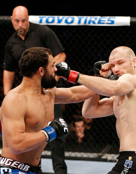 MONTREAL, QC - NOVEMBER 17:  Johny Hendricks (L) knocks out Martin Kampmann with a left in the first round to win their welterweight bout during UFC 154 on November 17, 2012  at the Bell Centre in Montreal, Canada.  (Photo by Josh Hedges/Zuffa LLC/Zuffa L