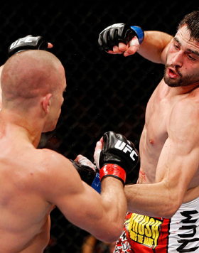 MONTREAL, QC - NOVEMBER 17:  Carlos Condit (L) fights against Georges St-Pierre in their welterweight title bout during UFC 154 on November 17, 2012  at the Bell Centre in Montreal, Canada.  (Photo by Josh Hedges/Zuffa LLC/Zuffa LLC via Getty Images)