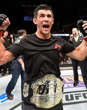 INGLEWOOD, CA - JUNE 04: Dominick Cruz  celebrates after defeating Urijah Faber by unanimous decision in their UFC bantamweight championship bout during the UFC 199 event at The Forum on June 4, 2016 in Inglewood, California.  (Photo by Josh Hedges/Zuffa 