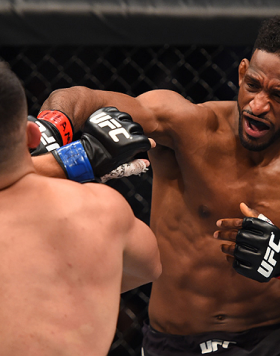 MONTERREY, MEXICO - NOVEMBER 21:  (R-L) Neil Magny of the United States punches Kelvin Gastelum of the United States in their welterweight bout during the UFC Fight Night event at Arena Monterrey on November 21, 2015 in Monterrey, Mexico.  (Photo by Jeff 