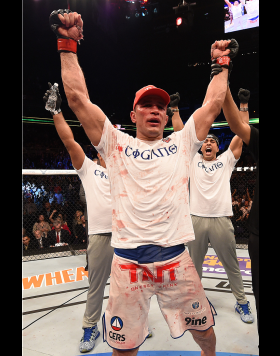 PHOENIX, AZ - DECEMBER 13:  Junior dos Santos of Brazil celebrates after defeating Stipe Miocic by unanimous decision after their heavyweight fight during the UFC Fight Night event at the U.S. Airways Center on December 13, 2014 in Phoenix, Arizona.  (Pho