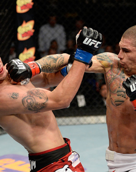 ATLANTIC CITY, NJ - JULY 16: (R-L) Lucas Martins punches Alex White in their featherweight bout during the UFC Fight Night event at Revel Casino on July 16, 2014 in Atlantic City, New Jersey. (Photo by Jeff Bottari/Zuffa LLC/Zuffa LLC via Getty Images)