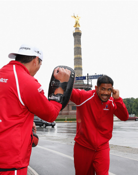 BERLIN, GERMANY - MAY 28:  Mark Munoz (R) holds a Guerillia open air training session for fans and media at Victoria Statue on May 28, 2014 in Berlin, Germany.  (Photo by Boris Streubel/Zuffa LLC/Zuffa LLC via Getty Images)