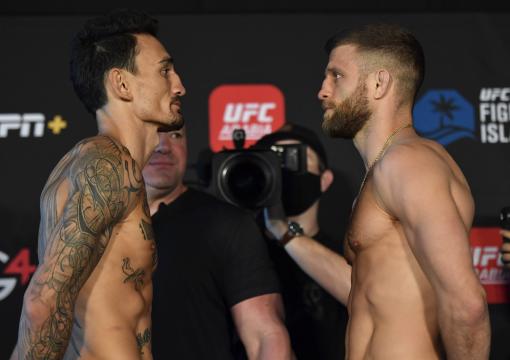 Max Holloway and Calvin Kattar face off during the UFC weigh-in at Etihad Arena on UFC Fight Island on January 15, 2021 in Abu Dhabi, United Arab Emirates. (Photo by Jeff Bottari/Zuffa LLC)