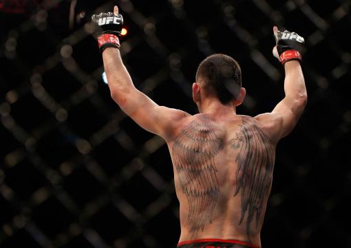 Max Holloway reacts after his TKO victory over Will Chope in their featherweight bout during the UFC Fight Night event at the Marina Bay Sands Resort on January 4, 2014 in Singapore. (Photo by Josh Hedges/Zuffa LLC)
