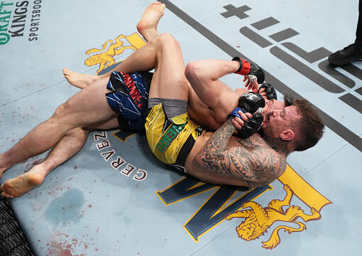 Renato Moicano of Brazil submits Alexander Hernandez in their lightweight fight during the UFC 271 event at Toyota Center on February 12, 2022 in Houston, Texas. (Photo by Josh Hedges/Zuffa LLC)