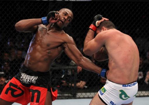 Jon Jones punches Mauricio "Shogun" Rua during their light heavyweight championship bout at UFC 128 at the Prudential Center on March 19, 2011 in Newark, New Jersey. (Photo by Al Bello/Zuffa LLC)