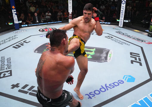 Vicente Luque kicks Rafael Dos Anjos of Brazil in a welterweight fight during the UFC Fight Night event at UFC APEX on August 12, 2023 in Las Vegas, Nevada. (Photo by Al Powers/Zuffa LLC)