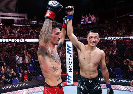 Max Holloway and Chan Sung Jung of South Korea react after their featherweight bout during the UFC Fight Night event at Singapore Indoor Stadium on August 26, 2023 in Singapore. (Photo by Suhaimi Abdullah/Zuffa LLC)