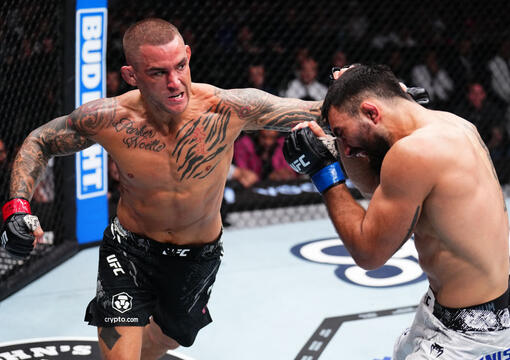 Dustin Poirier punches Benoit Saint Denis of France in a lightweight fight during the UFC 299 event at Kaseya Center on March 09, 2024 in Miami, Florida. (Photo by Chris Unger/Zuffa LLC)