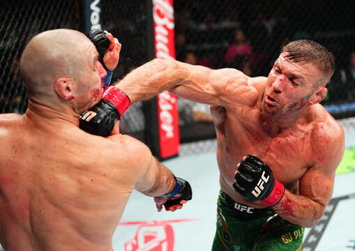 Dricus Du Plessis of South Africa punches Sean Strickland in the UFC middleweight championship fight during the UFC 312 event at Qudos Bank Arena on February 09, 2025 in Sydney, Australia. (Photo by Jeff Bottari)
