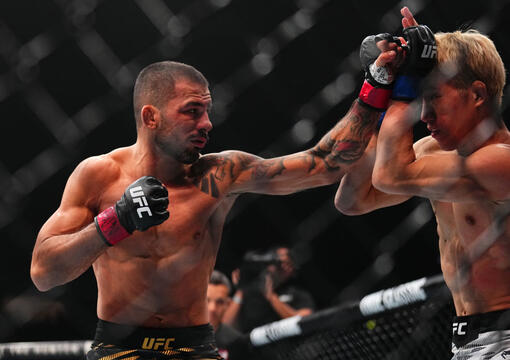 Alexandre Pantoja punches Kai Asakura in the UFC flyweight championship bout during the UFC 310 event at T-Mobile Arena on December 07, 2024 in Las Vegas, Nevada. (Photo by Chris Unger/Zuffa LLC)