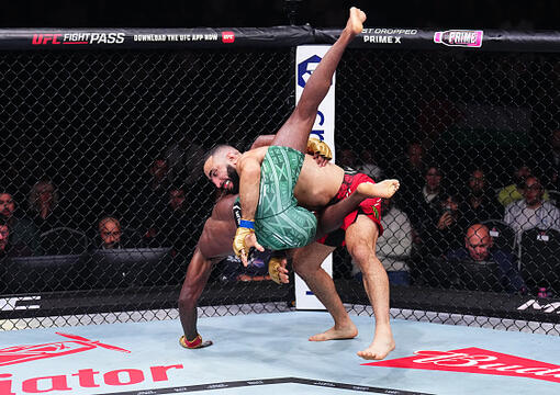 Belal Muhammad takes down Leon Edwards of Jamaica in the UFC welterweight championship bout during the UFC 304 event at Co-op Live on July 27, 2024 in Manchester, England. (Photo by Chris Unger/Zuffa LLC)