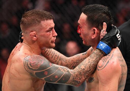 Dustin Poirier and Max Holloway embrace after finishing five rounds in their interim lightweight championship bout during the UFC 236 event at State Farm Arena on April 13, 2019 in Atlanta, Georgia. 