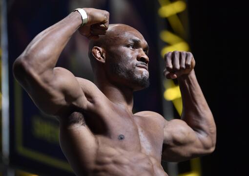 Kamaru Usman poses on the scale during the UFC 261 Weigh-In at at VyStar Veterans Memorial Arena on April 23, 2021 in Jacksonville, Florida. 