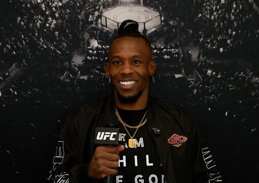 UFC bantamweight Ode Osbourne sits in front of a black UFC Octagon background