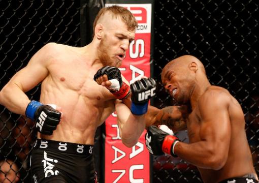 STOCKHOLM, SWEDEN - APRIL 06: (L-R) Conor McGregor punches Marcus Brimage in their featherweight fight at the Ericsson Globe Arena on April 6, 2013 in Stockholm, Sweden. (Photo by Josh Hedges/Zuffa LLC/Zuffa LLC via Getty Images)