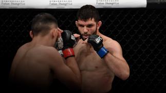 SHENZHEN, CHINA - AUGUST 31: (R-L) Thiago Moises of Brazil battles Damir Ismagulov of Russia in their lightweight bout during the UFC Fight Night event in Shenzhen, China. (Photo by Brandon Magnus/Zuffa LLC)