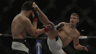 LAS VEGAS, NV - JULY 12: (R-L) Stephen Thompson kicks Jake Ellenberger in their welterweight bout during the Ultimate Fighter Finale inside MGM Grand Garden Arena on July 12, 2015 in Las Vegas, Nevada. (Photo by Mitch Viquez/Zuffa LLC/Zuffa LLC via Getty Images)