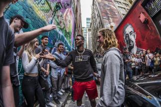Israel Adesanya Interacts With Fans At The Unveiling Of His Mural On Hosier Lane in Melbourne, AU, October 2019 (Photo by Juan Cardenas/Zuffa LLC)