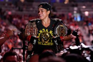 Amanda Nunes of Brazil celebrates after defeating Holly Holm in their UFC bantamweight championship fight during the UFC 239 event at T-Mobile Arena on July 7 2019 in Las Vegas, Nevada. (Photo by Jeff Bottari/Zuffa LLC)