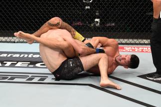 Joel Alvarez of Spain attempts to submit Alexander Yakovlev of Russia in their lightweight bout during the UFC 254 event on October 24, 2020 on UFC Fight Island, Abu Dhabi, United Arab Emirates. (Photo by Josh Hedges/Zuffa LLC via Getty Images)