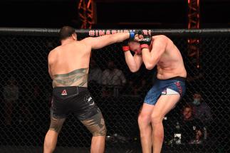 Tai Tuivasa of Australia punches Stefan Struve of The Netherlands in their heavyweight bout during the UFC 254 event on October 24, 2020 on UFC Fight Island, Abu Dhabi, United Arab Emirates. (Photo by Josh Hedges/Zuffa LLC via Getty Images)