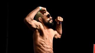 Deiveson Figueiredo of Brazil poses on the scale during the UFC Fight Night ceremonial weigh-in at Chartway Arena on February 28, 2020 in Norfolk, Virginia. (Photo by Mike Roach/Zuffa LLC)