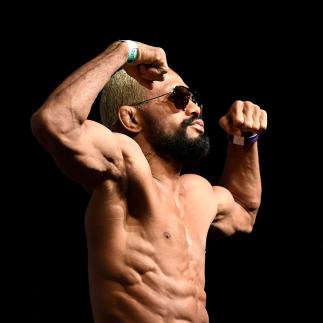 Deiveson Figueiredo of Brazil poses on the scale during the UFC Fight Night ceremonial weigh-in at Chartway Arena on February 28, 2020 in Norfolk, Virginia. (Photo by Mike Roach/Zuffa LLC)