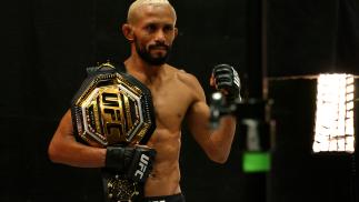 Deiveson Figueiredo Poses With Flyweight Championship Belt