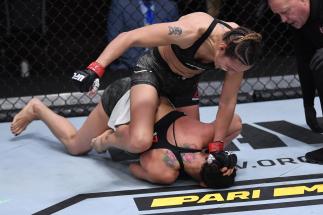 Antonina Shevchenko of Kyrgyzstan (top) punches Ariane Lipski of Brazil in their women's flyweight bout during the UFC 255 event at UFC APEX on November 21, 2020 in Las Vegas, Nevada. (Photo by Jeff Bottari/Zuffa LLC)
