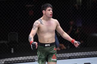 Brandon Moreno of Mexico celebrates his TKO victory over Brandon Royval in their flyweight bout during the UFC 255 event at UFC APEX on November 21, 2020 in Las Vegas, Nevada. (Photo by Jeff Bottari/Zuffa LLC)