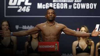 Ode' Osbourne poses on the scale during a ceremonial weigh-in for UFC 246 at Park Theater at Park MGM on January 17, 2020 in Las Vegas, Nevada. Osbourne will face Brian Kelleher at UFC 246 on January 18 in Las Vegas.
