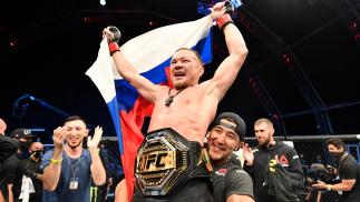 Petr Yan of Russia celebrates after his TKO victory over Jose Aldo in their UFC bantamweight championship fight during the UFC 251 event at Flash Forum on UFC Fight Island on July 12, 2020 on Yas Island, Abu Dhabi, United Arab Emirates. (Photo by Jeff Bottari/Zuffa LLC)