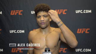 Alex Caceres reacts with UFC.com after his unanimous decision victory over featherweight Kevin Croom at UFC Fight Night: Rozenstruik vs Gane on February 27, 2021.