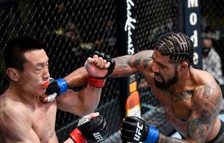 Max Griffin punches Song Kenan of China in their welterweight fight during the UFC Fight Night event at UFC APEX on March 20, 2021 in Las Vegas, Nevada. (Photo by Chris Unger/Zuffa LLC)