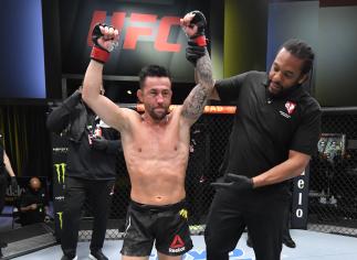 Pedro Munhoz of Brazil reacts after his victory over Jimmie Rivera in a bantamweight bout during the UFC Fight Night event at UFC APEX on February 27, 2021 in Las Vegas, Nevada. (Photo by Jeff Bottari/Zuffa LLC)