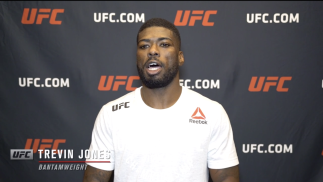 Trevin Jones reacts with UFC.com after his second-round TKO victory over bantamweight Mario Bautista at UFC 259: Blachowicz vs Adesanya on March 6, 2021.
