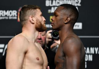 LAS VEGAS, NEVADA - MARCH 05: (L-R) Opponents Jan Blachowicz of Poland and Israel Adesanya of Nigeria face off during the UFC 259 weigh-in at UFC APEX on March 05, 2021 in Las Vegas, Nevada. (Photo by Jeff Bottari/Zuffa LLC)