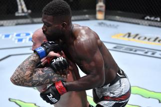 Impa Kasanganay works to secure a rear choke submission against Sasha Palatnikov of Hong Kong in a welterweight fight during the UFC Fight Night event at UFC APEX on April 10, 2021 in Las Vegas, Nevada. (Photo by Chris Unger/Zuffa LLC)