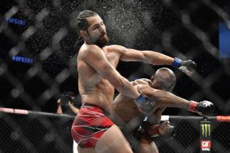 Kamaru Usman of Nigeria punches Jorge Masvidal in their UFC welterweight championship bout during the UFC 261 event at VyStar Veterans Memorial Arena on April 24, 2021 in Jacksonville, Florida. (Photo by Chris Unger/Zuffa LLC)