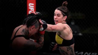 Norma Dumont of Brazil punches Ashlee Evans-Smith in their women's bantamweight bout during the UFC Fight Night at UFC APEX on November 28, 2020 in Las Vegas, Nevada. (Photo by Chris Unger/Zuffa LLC)