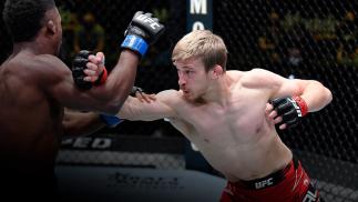 Arnold Allen of England punches Sodiq Yusuff of Nigeria in a featherweight fight during the UFC Fight Night event at UFC APEX on April 10, 2021 in Las Vegas, Nevada. (Photo by Chris Unger/Zuffa LLC)