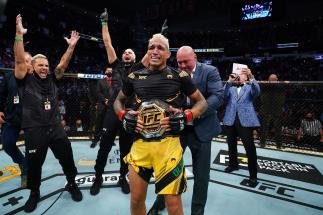 Charles Oliveira of Brazil reacts as UFC President Dana White places the UFC lightweight championship belt around his waist after defeating Michael Chandler at Toyota Center on May 15, 2021 in Houston, Texas. (Photo by Josh Hedges/Zuffa LLC)