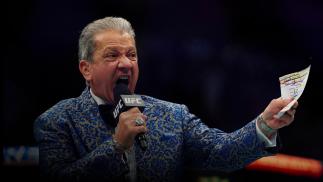 UFC Octagon Announcer Bruce Buffer signals the start of Shane Burgos and Edson Barboza of Brazil in their featherweight bout during the UFC 262 event at Toyota Center on May 15, 2021 in Houston, Texas. (Photo by Cooper Neill/Zuffa LLC)